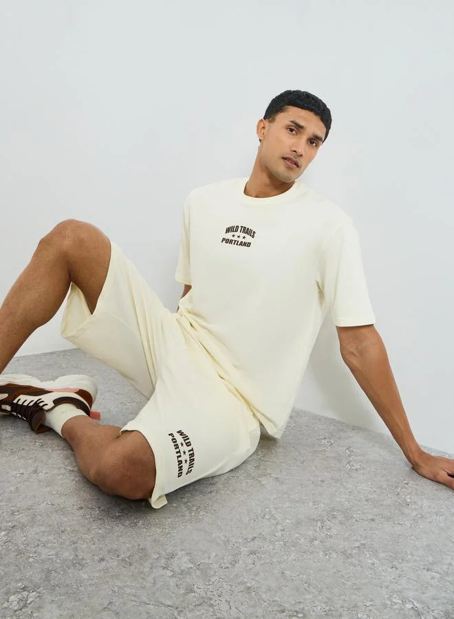 Styli  Men Cream Minimal Print Oversized T-Shirt and Shorts Co-Ords for Men | Best Price UAE